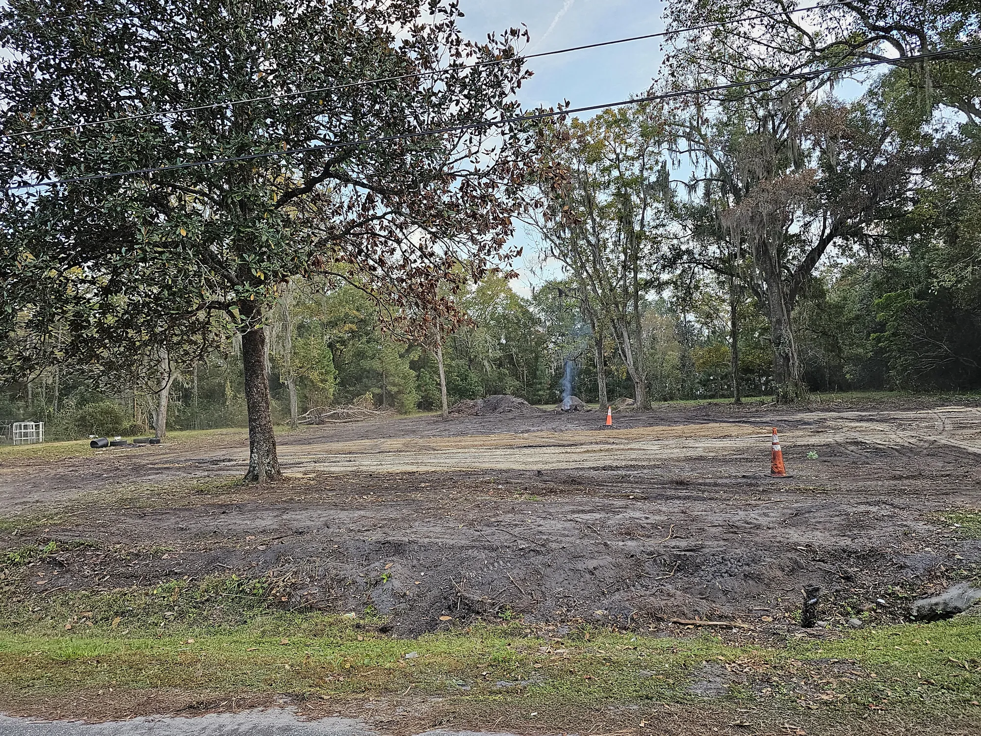 Rural land clearing work in progress with debris removed