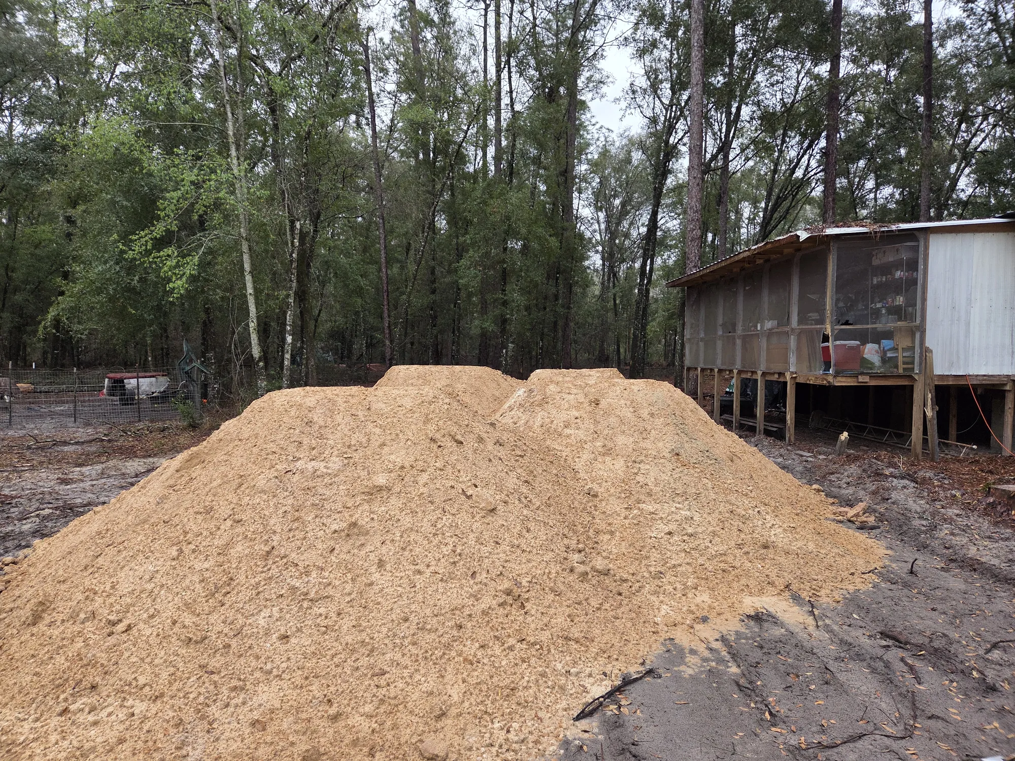 Large pile of mulched material from tree and brush grinding